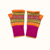 Colorful knitted fingerless gloves with a pattern on a white background