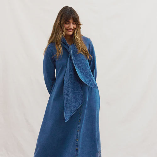 Woman wearing a Binny denim dress with a matching scarf against a white background