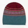 Knitted Eribe beanie with a patterned band on a white background