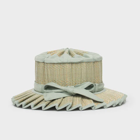 Light green hat with a bow on a white background