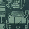 Close-up of a woven merino wool featuring vintage Melbourne tram and street signs in dark green and light sage green.
