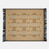 Beige woven blanket with black fringe on a white background