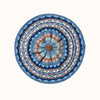 Round blue and orange patterned woollen beret on a white background